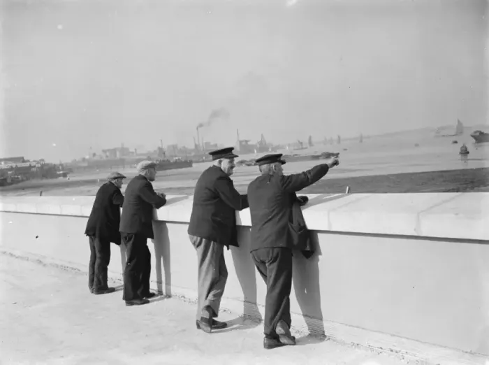 Framed Print : Men enjoying the riversite view over the River Thames at Erith in Kent