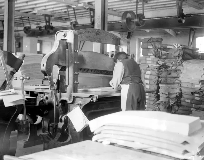 Framed Print : At Messrs James Burns Book Binding works at Esher. Quire cutting for folding by hand Framed Print : At Messrs James Burns Book Binding works at Esher. Quire cutting for folding by hand