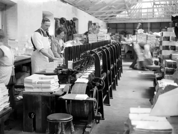 Framed Print : At Messrs James Burns Book Binding works at Esher. An ingenious machine whci collects