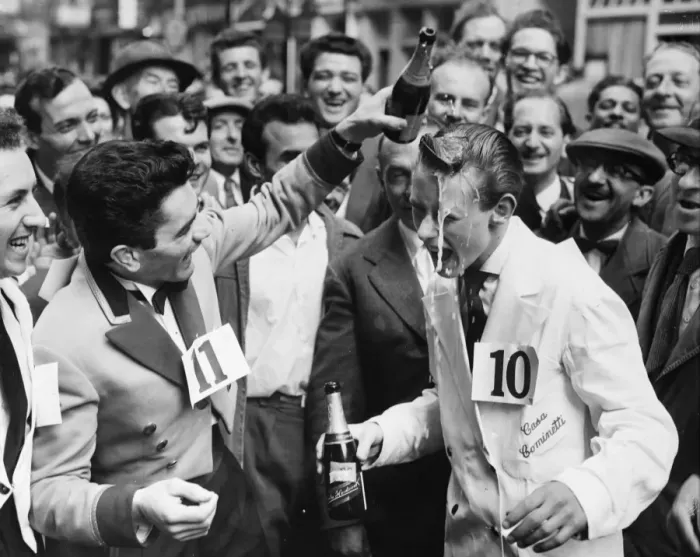 Framed Print : Michael Bushell, the youngest competitor at age 15, is splashed with champagne by Framed Print : Michael Bushell, the youngest competitor at age 15, is splashed with champagne by