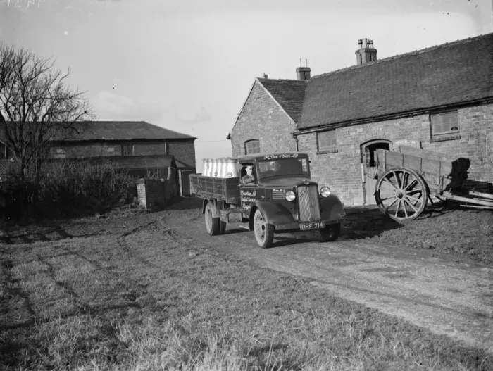 Framed Print : A milk lorry full of milk churns leaves the farmyard. 1937 Framed Print : A milk lorry full of milk churns leaves the farmyard. 1937