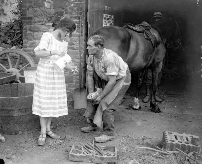 Framed Print : Miss Edna Maude, the seventeen year old dancer on holiday - giving the blacksmith Framed Print : Miss Edna Maude, the seventeen year old dancer on holiday - giving the blacksmith