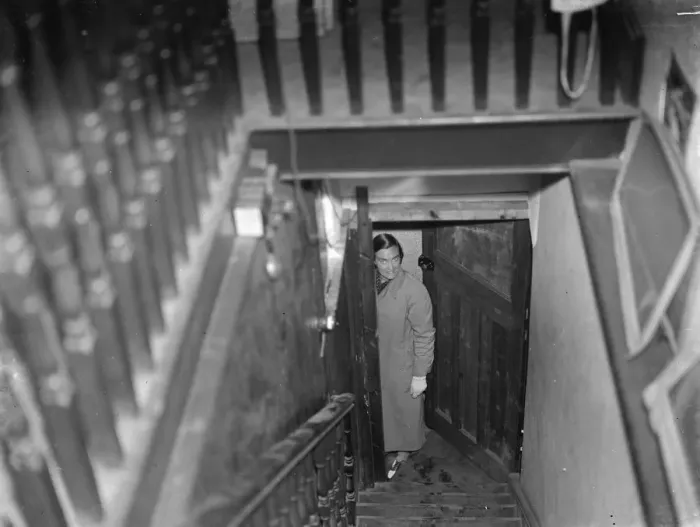 Framed Print : Miss Haken posing from the bottom of the stairs in Sidcup, Kent. 1937