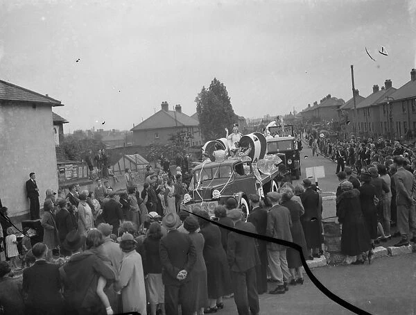 Miss Joan, the Dartford Carnival Queen, and her retinue on the back of a flatbed