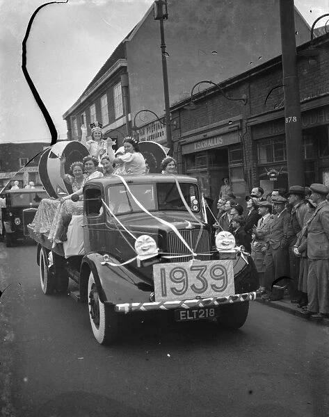Miss Joan, the Dartford Carnival Queen, and her retinue, on the back of a flatbed