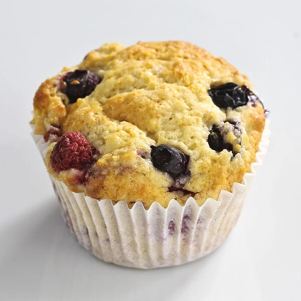 MIxed berry muffin with blueberries and raspberries in paper case credit: Marie-Louise