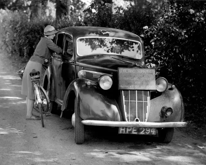 Framed Print : Mobile Office for Collecting Electricity Dues A car is used as a mobile office for