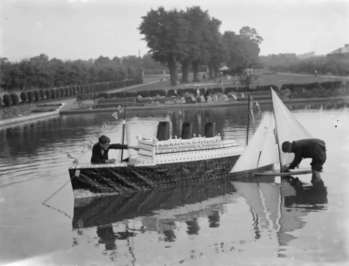 Framed Print : Model of the liner RMS Queen Mary is released upon the the water alongside a model yacht Framed Print : Model of the liner RMS Queen Mary is released upon the the water alongside a model yacht