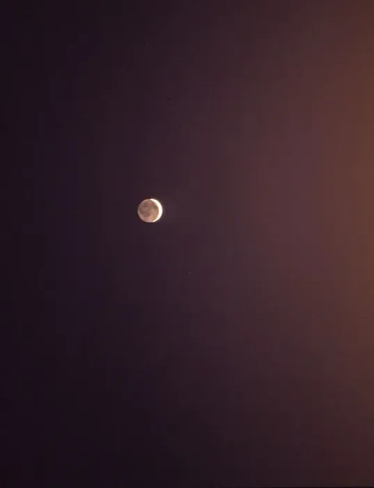 Framed Print : Moon in the night sky. Crescent moon with the reflection of sunlight thrown by Framed Print : Moon in the night sky. Crescent moon with the reflection of sunlight thrown by