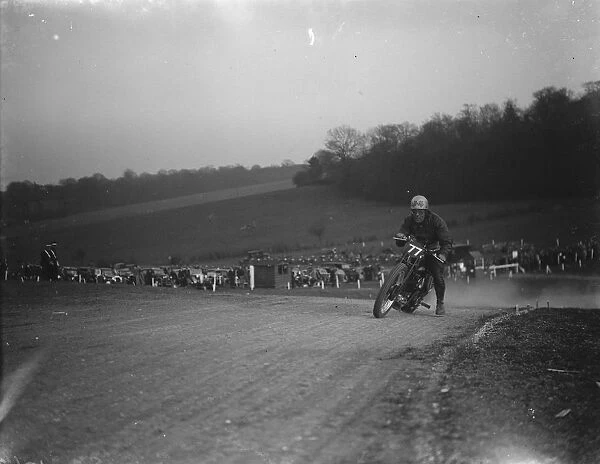 Motor cycling races at Brands Hatch on Easter Sunday. W C Lock on a scramblers take