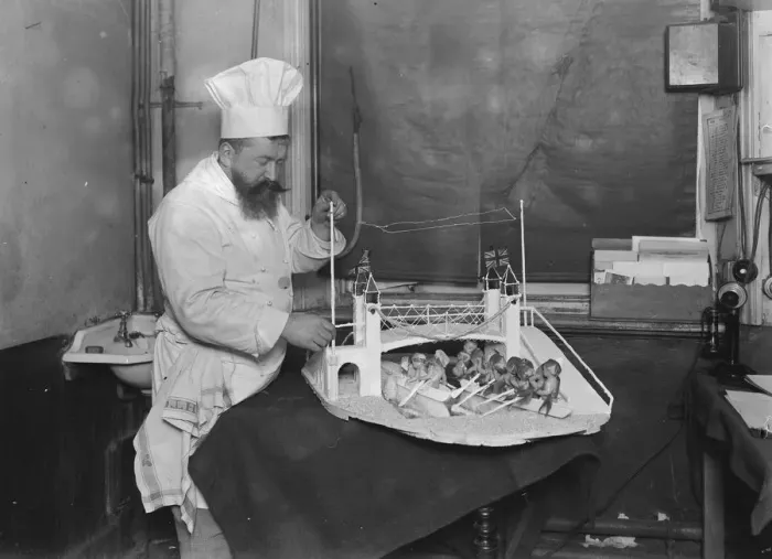 Framed Print : Mr Cantelupe, The Criterion chef, At work on his model of the boat race 23 March 1923 Framed Print : Mr Cantelupe, The Criterion chef, At work on his model of the boat race 23 March 1923