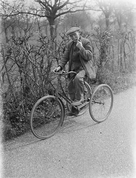 Mr Charles Johnson on a tricycle in Kingsdown, Kent. 1937