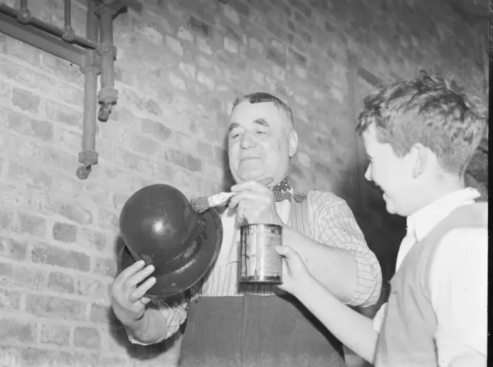Framed Print : Mr Charlie Hever painting tar onto a bowler hat in Eynsford, Kent. 1937 Framed Print : Mr Charlie Hever painting tar onto a bowler hat in Eynsford, Kent. 1937