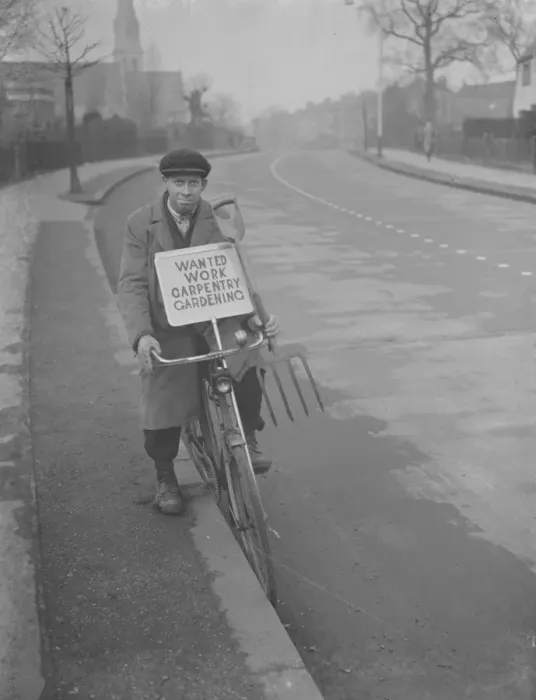 Framed Print : Mr F J Archer rides his bicycle with a placard advertising his services Framed Print : Mr F J Archer rides his bicycle with a placard advertising his services