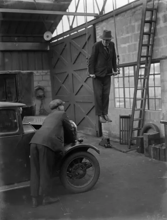 Framed Print : Mr Herbert Gilbertson on a trapeze in his garage in Sidcup. 1935 Framed Print : Mr Herbert Gilbertson on a trapeze in his garage in Sidcup. 1935