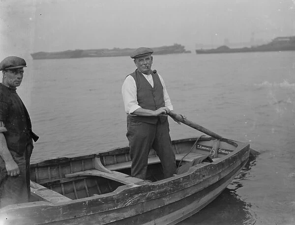 Mr J H Salmon, landlord of the Long Reach Tavern in Dartford, Kent, on a barge