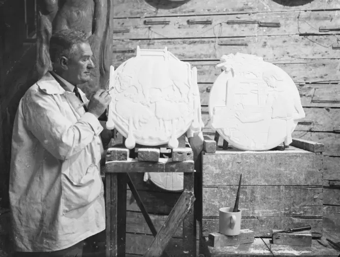 Framed Print : Mr James Woodford at work in his London studio on the plaster casts of the plaques