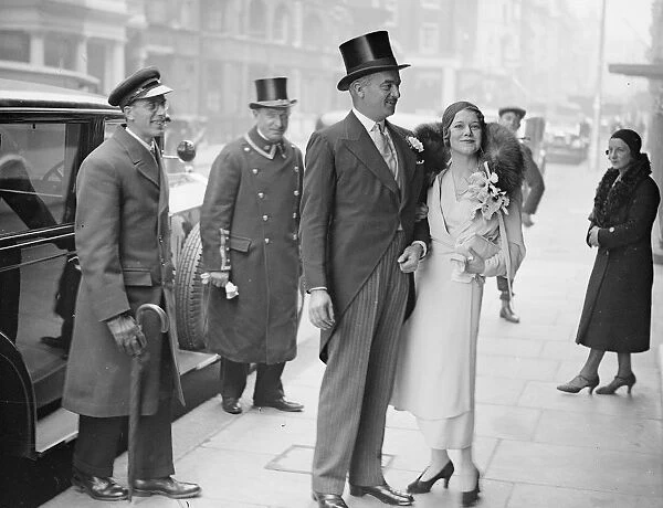 Mr John Dewar and Mrs K McNeil photographed outside Claridges after their wedding