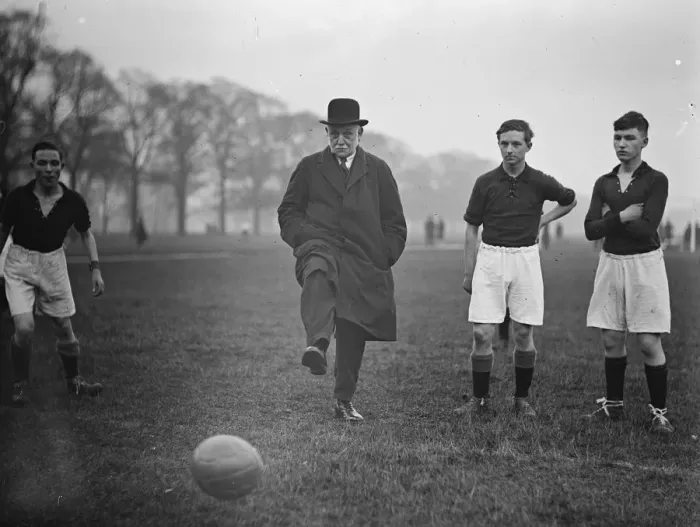 Framed Print : Mr Lansbury Kicks off The first Commissioner of Works starts football match
