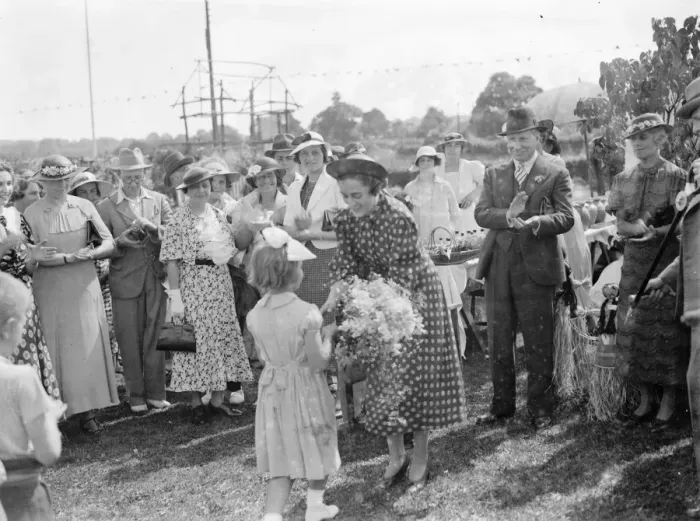 Framed Print : Mrs Bossom wife of Mr Alfred Bossom MP is presented with a bouquet after the official Framed Print : Mrs Bossom wife of Mr Alfred Bossom MP is presented with a bouquet after the official