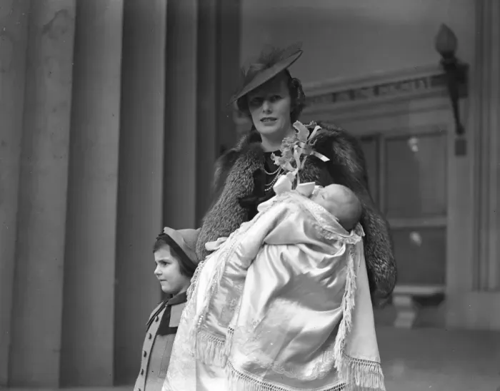 Framed Print : Mrs David Forbes and her infant son after the latters christening at the Guards Chapel