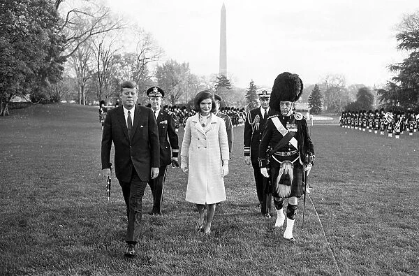 Mrs Jacqueline Kennedy, the First Lady of America, walks across the South Lawn