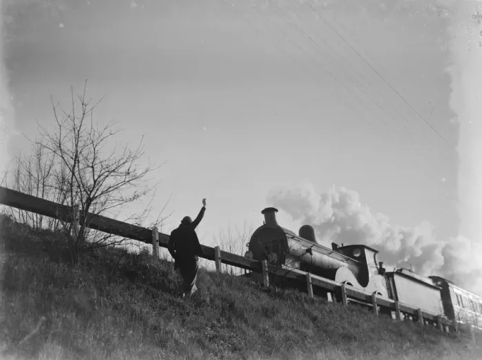 Framed Print : Muriel Haken waves to a passing train from a railway embankment. 1939 Framed Print : Muriel Haken waves to a passing train from a railway embankment. 1939