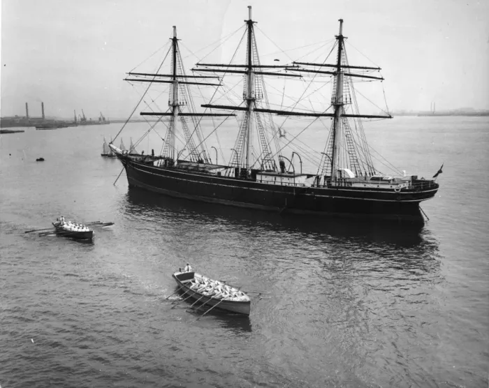 Framed Print : Naval cadets row to the training ship HMS Worcester in front of The Cutty Sark Framed Print : Naval cadets row to the training ship HMS Worcester in front of The Cutty Sark