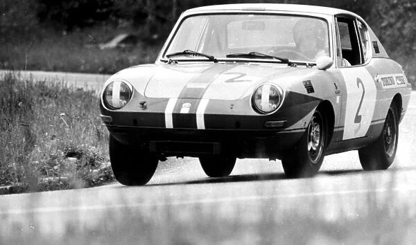The new 1, 000. c. c. Racer-team sports car by bertone of Italy seen in action during