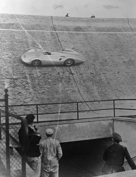 Framed Print : New German streamlined racing car sets record. Driving a new auto union streamlined car