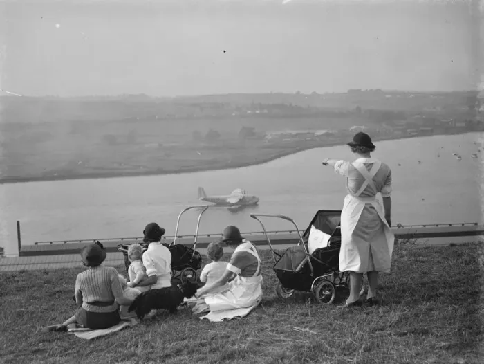 Framed Print : Nursemaids in Rochester, Kent, have a good view of the flying boat tests on Framed Print : Nursemaids in Rochester, Kent, have a good view of the flying boat tests on