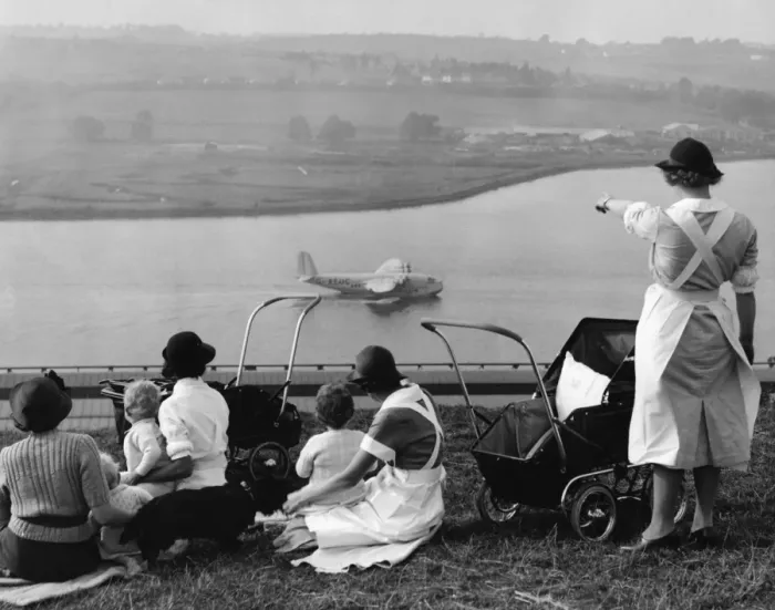 Framed Print : Nursemaids in Rochester, Kent, have a good view of the flying boat tests on Framed Print : Nursemaids in Rochester, Kent, have a good view of the flying boat tests on