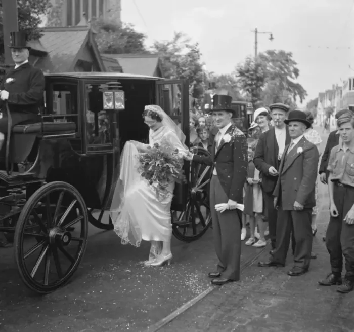 Framed Print : An old fashion wedding at Eltham Parish church. The bride climbing onto the horse