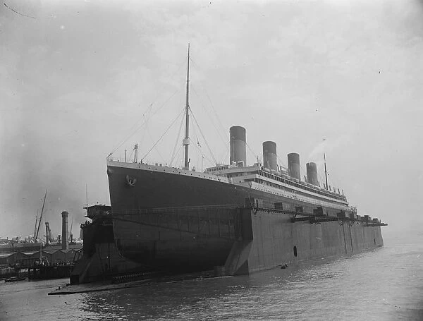 Olympic enters Southamptons huge floating dock. 12 July 1924
