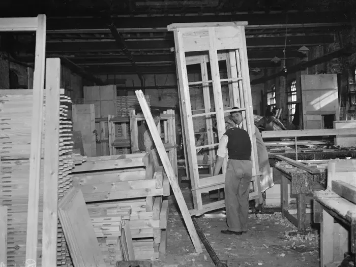 Framed Print : A pair of joiners works on a piece at the G Ellis joinery works in Hackney