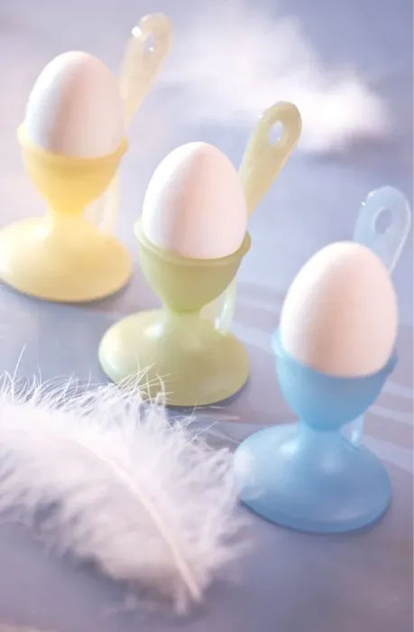 Framed Print : Pastel coloured eggcups with boiled eggs and feather decoration credit: Marie-Louise Framed Print : Pastel coloured eggcups with boiled eggs and feather decoration credit: Marie-Louise