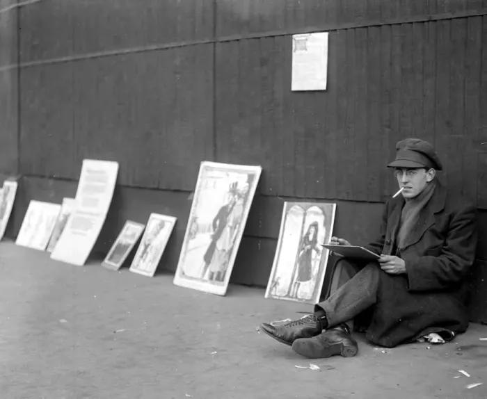 Framed Print : Pavement artist in oils. Ex Officer paints pictures in oil while seated on Framed Print : Pavement artist in oils. Ex Officer paints pictures in oil while seated on