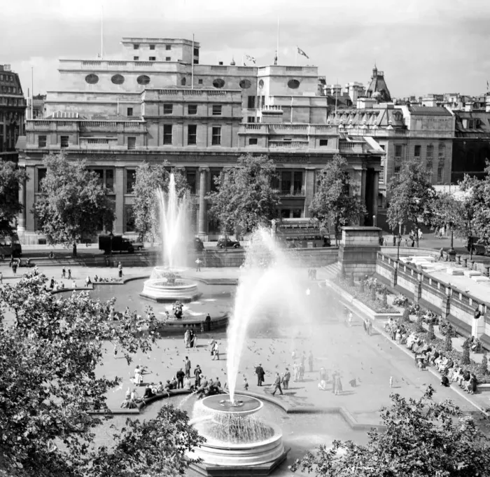 Framed Print : People enjoying the sunshine and the fountains in Trafalgar Square, London, England Framed Print : People enjoying the sunshine and the fountains in Trafalgar Square, London, England