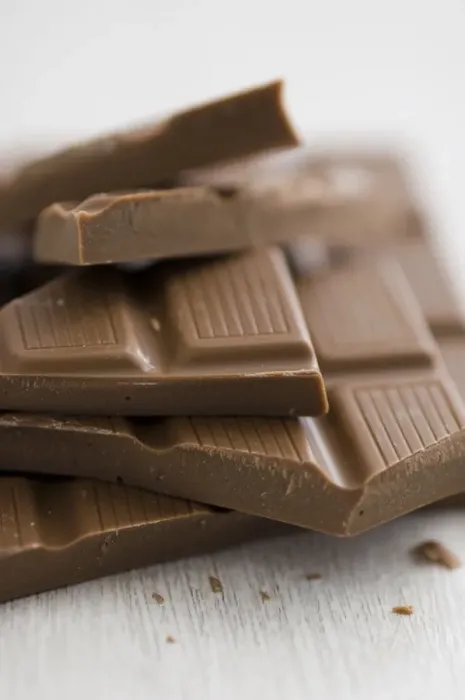 Framed Print : Pile of broken pieces of mik chocolate bar on white surface. credit: Marie-Louise Framed Print : Pile of broken pieces of mik chocolate bar on white surface. credit: Marie-Louise
