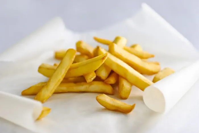 Framed Print : Pile of french fries on greaseproof paper credit: Marie-Louise Avery / thePictureKitchen Framed Print : Pile of french fries on greaseproof paper credit: Marie-Louise Avery / thePictureKitchen