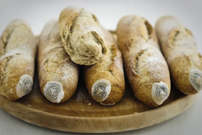Framed Print : Pile of stoneground wholemeal organic baguettes on woden board credit: Marie-Louise Framed Print : Pile of stoneground wholemeal organic baguettes on woden board credit: Marie-Louise
