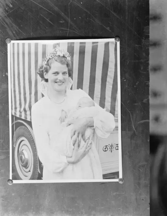Framed Print : A pinned up photo of the Dartford Carnival Queen holding a baby. 1937 Framed Print : A pinned up photo of the Dartford Carnival Queen holding a baby. 1937