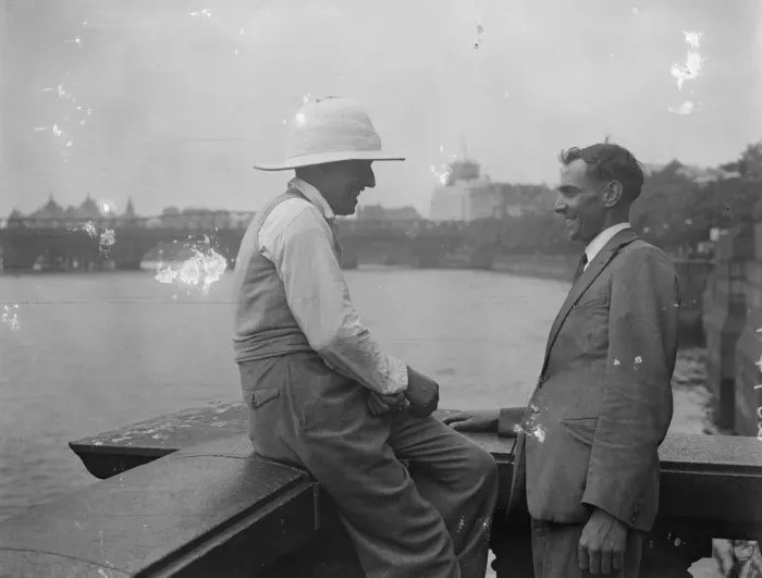 Framed Print : Pith Helmets on the embankment. A visitor to London was seen wearing a pith helmet Framed Print : Pith Helmets on the embankment. A visitor to London was seen wearing a pith helmet