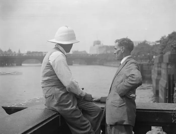 Framed Print : Pith Helmets on the embankment. A visitor to London was seen wearing a pith helmet Framed Print : Pith Helmets on the embankment. A visitor to London was seen wearing a pith helmet