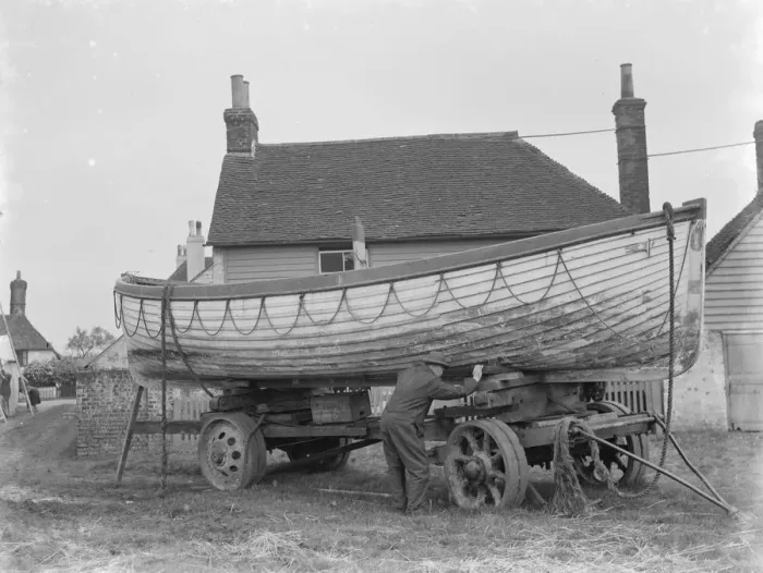 Framed Print : A policeman builds a boat on the village green in Faversham, Kent. 1937 Framed Print : A policeman builds a boat on the village green in Faversham, Kent. 1937