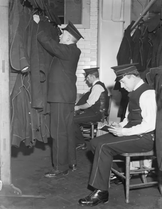 Framed Print : Postmen keep colds at bay. Dry wet clothes and special room at GPO. Specially fitted