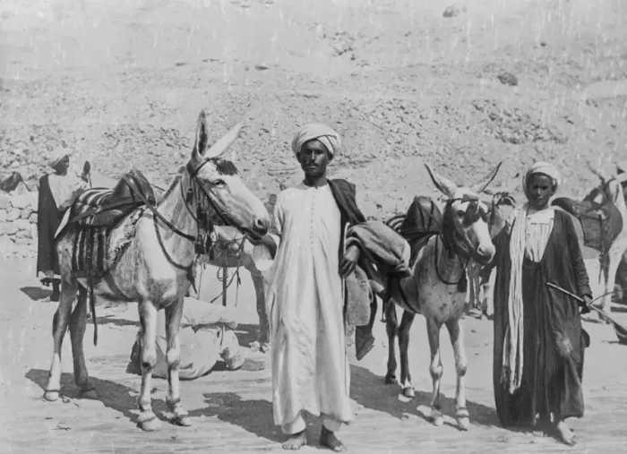 Framed Print : Praying for rain. Egyptian donkey boys who are praying for rain to wash away part Framed Print : Praying for rain. Egyptian donkey boys who are praying for rain to wash away part
