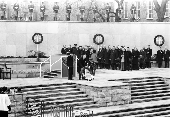 Framed Print : President Eamonn de Valera of Eire ( hatless ) assisted by a uniformed man lays a