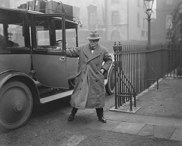 Prime Minister David Lloyd George arriving back at 10, Downing street this afternoon