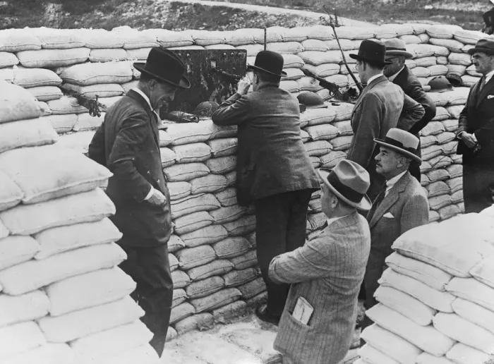 Framed Print : The Prime Minister in the trenches. Mr Stanley Baldwin handles a machine gun during Framed Print : The Prime Minister in the trenches. Mr Stanley Baldwin handles a machine gun during